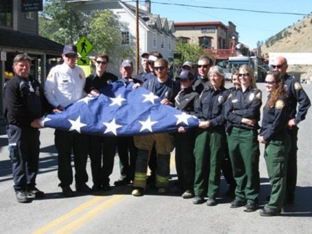 Personnel Holding American Flag
